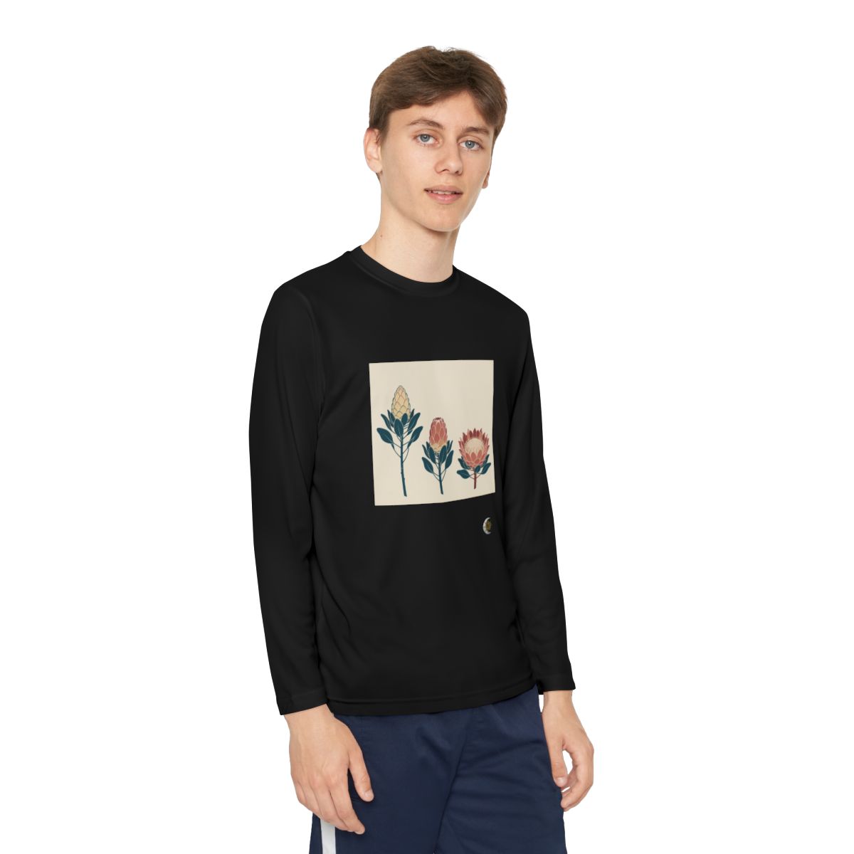 HD Protea Trio Youth Long Sleeve Competitor Tee in Black, front view on a model.