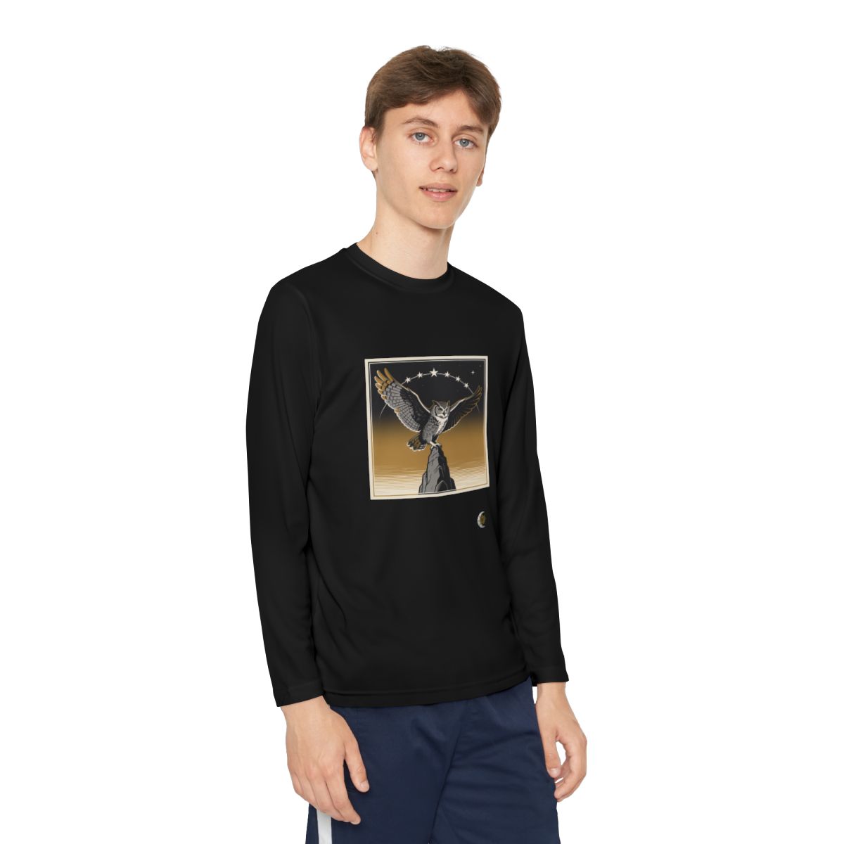 HD Golden Nightwatch Youth Long Sleeve Competitor Tee in Black, front view on a model.