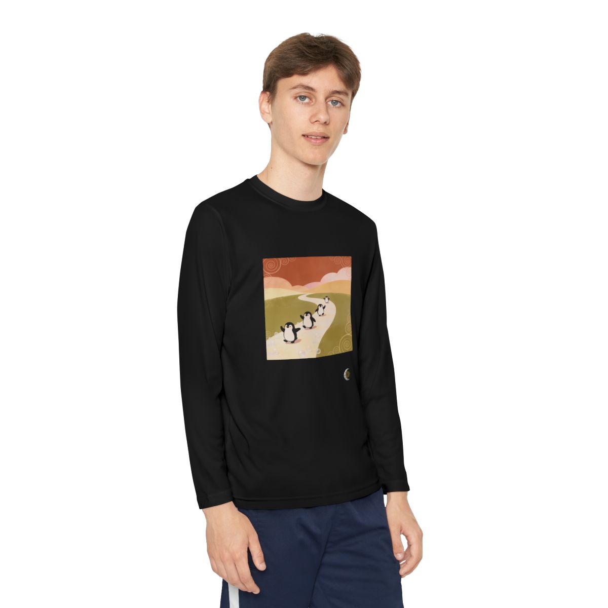 HD Ambertrail Penguins Youth Long Sleeve Competitor Tee in Black, front view on a model.